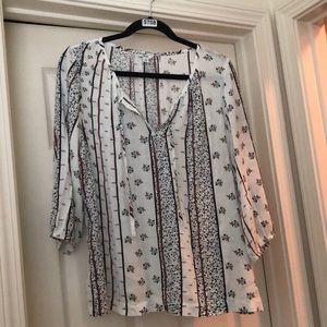 This shirt is a Petite extra-large, very flowy fabric comfortable to wear